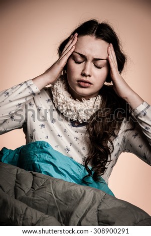 Asian caucasian woman having a head ache