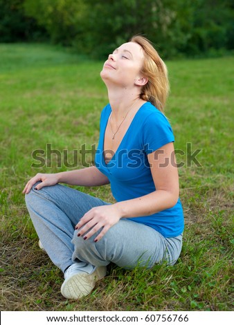 Girl meditates in nature