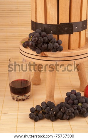 small wooden wine press for pressing grapes to produce wine