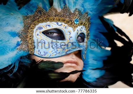 VENICE, ITALY - MARCH 7: Unidentified woman in Venice mask at St. Mark\'s Square, Carnival of Venice on March 7, 2011. The annual carnival was held in 2011 from February 26 to March 8, 2011.