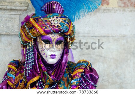 VENICE, ITALY - MARCH 7: Unidentified woman in courtesan mask at St. Mark\'s Square, Carnival of Venice on March 7, 2011. The annual carnival was held in 2011 from February 26 to March 8, 2011.