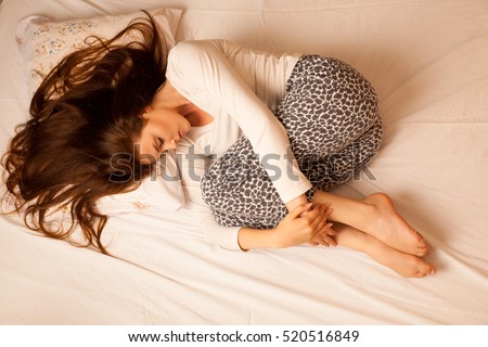 sickness stomach ache pain period, woman suffering isolated over white background