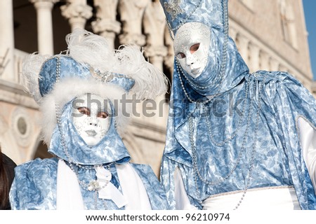 VENICE, ITALY - FEBRUARY 16: Unidentified people in Venetian masks at St. Mark\'s Square, Carnival of Venice on February 16, 2012. The annual carnival is from February 11 to February 21, 2012.