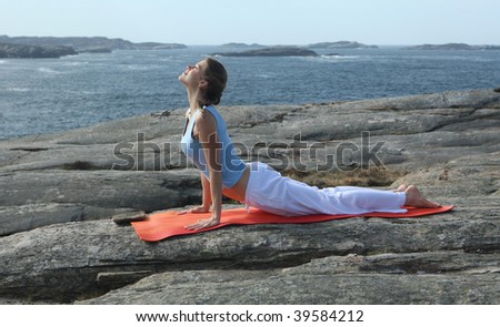 young woman exercising power yoga