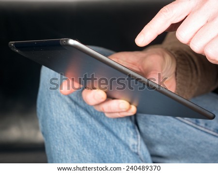 two Hands holding Tablet and tap text