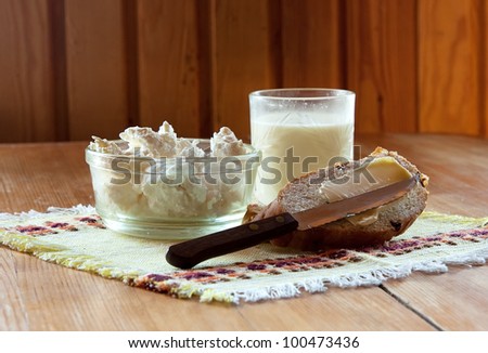Morning sandwich with butter , milk and cheese