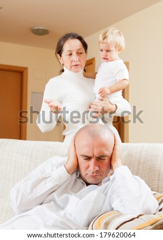Family quarrel. Grandmother having problems with her son at home