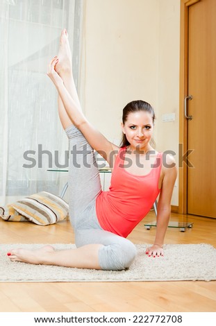 skinny girl doing gymnastics at home