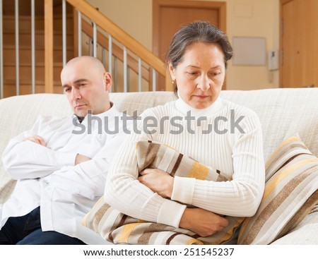 Family quarrel. Woman having problems with her husband at home
