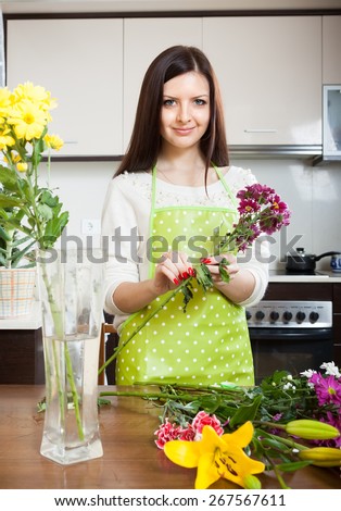 Girl making  beautiful bouquet of flowers cutting