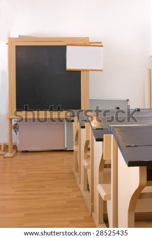 vintage class room with school desks and school board