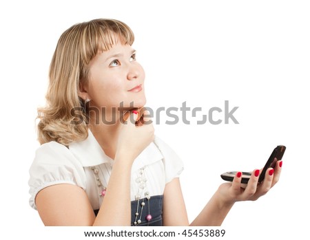 Girl putting facial powder on her face, white background.