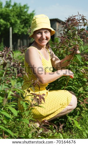 Mature lady taking care of her plants