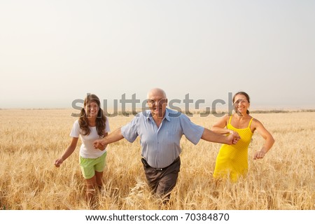 Family of Three in a field . freedom concept