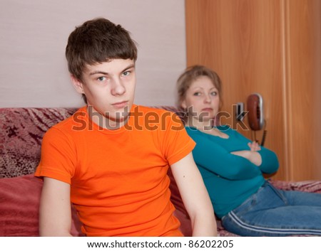 Mother and teen  son having quarrel at home