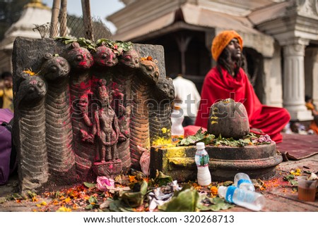 KATHMANDU/NEPAL - February 2015 - Maha Shivaratri festival  People worship Lord Shiva statue . An unidentified yogi meditating inside the festival , 17, 2015 in Kathmandu, Nepal.