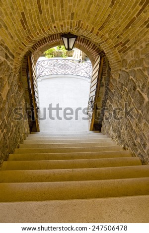 old stairs leading to open gate