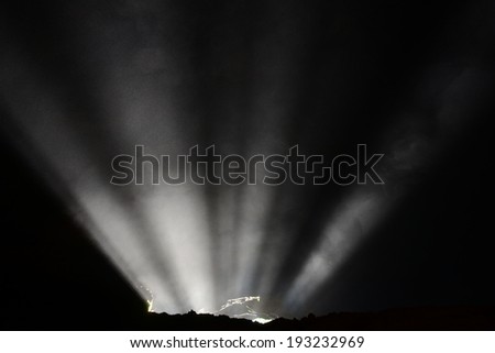 Beam of light penetrating the mine entrance.