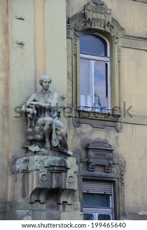 Statue from communist era on an old building in Gyor, Hungary.