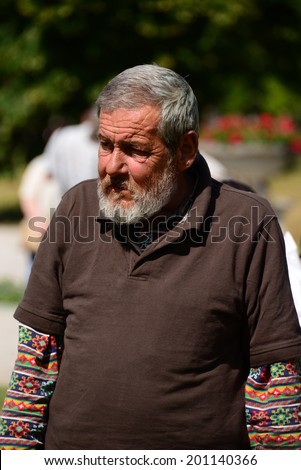 BRATISLAVA, SLOVAKIA - JUNE 15, 2014 A homeless person at the presidential inauguration of Andrej Kiska on June 15, 2014 in Bratislava, Slovakia.