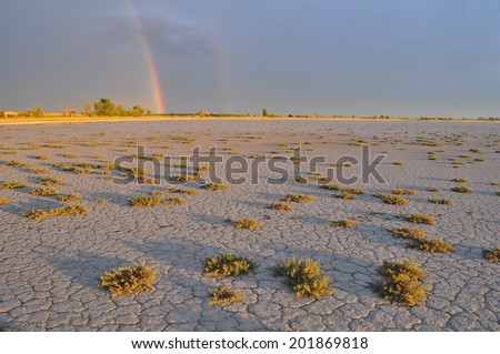 Sunset after storm on a dry bed at Neusiedler See, Austria.