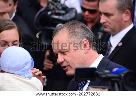 President Andrej Kiska with a baby during the presidential inauguration on June 15, 2014 in Bratislava, Slovakia.