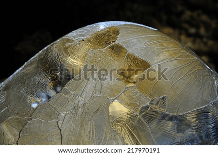 An extreme detail of a thawing ice stalagmite.