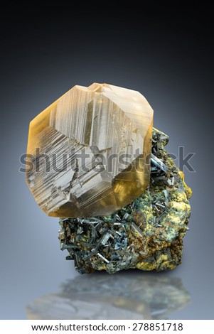 Yellowish green calcite with stibnite from China.
