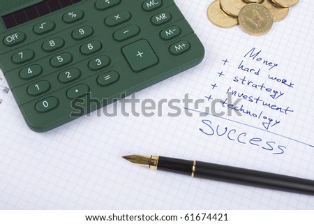 Ink pen on the paper with some business quotes, calculator and coins