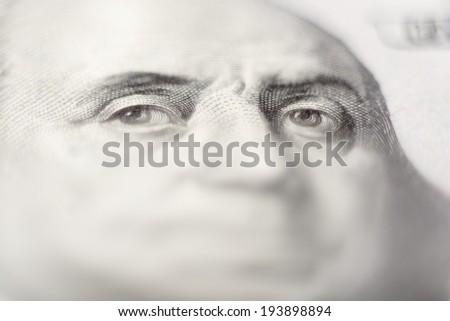 Human eyes. Fragment of 100 US dollars banknote.