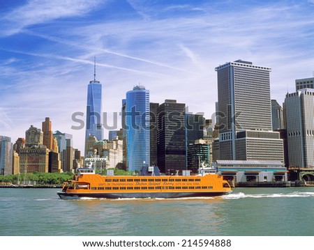 New York City, USA - June 19, 2014: Staten Island Ferry on the East River. Showing the Battery Maritime Building, terminal for the Staten Island Ferry and the ferry to Governors Island.