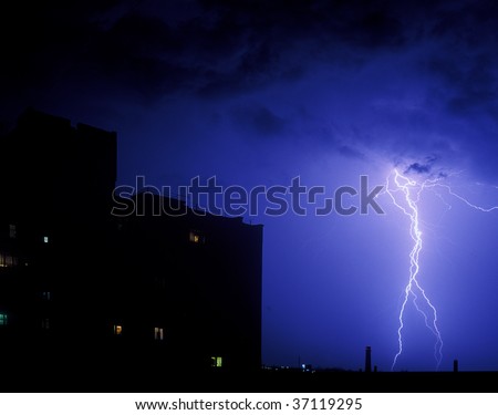 Lightning strike in the night over a city
