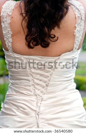 The Back of a White Lace up Wedding Dress