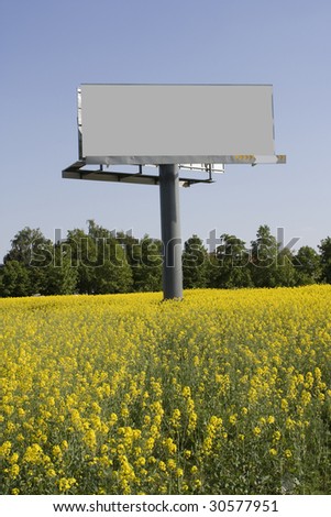 Big billboard in field with rapeseed