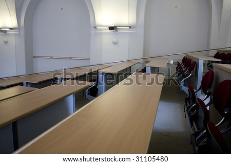 Class room with stairs, desks and seats