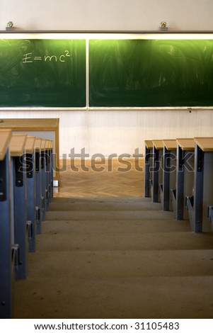 Classroom with green blackboard at university or college