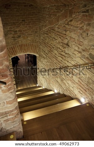 Brick hallway entrance to an undergound bar