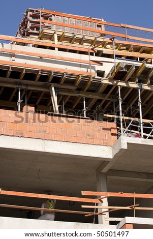 Construction site - building a large brick block of flats