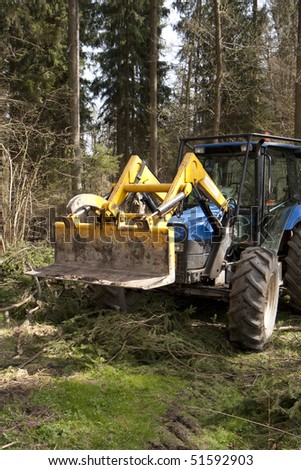 Forester\'s tractor in a wood