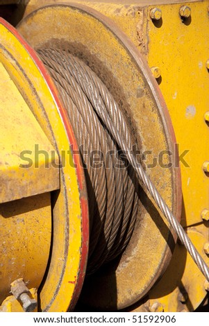 Yellow reel with metal cable