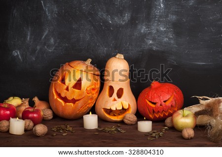 Happy Halloween; Jack-o-lantern on a dark background; pumpkin; candles; Still Halloween