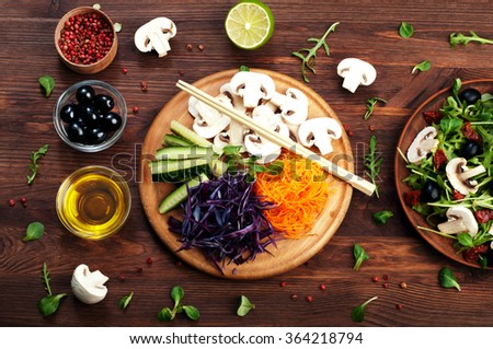 Vegetarian concept. Shredded raw vegetables on a wooden board. Products for quick weight loss. A balanced menu of vegetables.