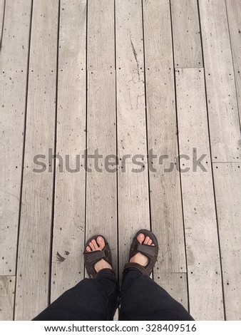top view : foot on vintage wood floor