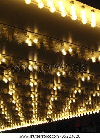 Looking up at an overhang with halogen marquee lights