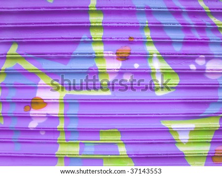 Lavender and blue spray paint on metal garage door
