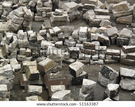 Stacks of large concrete slabs at a construction site