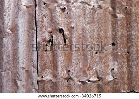 Close up of text to rusted metal siding