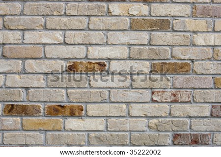 Acid washed brick wall with accent red and yellow pieces