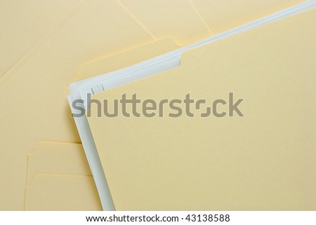 File Folder with Paper on Messy Pile