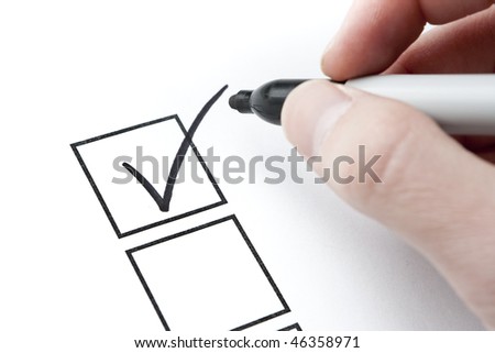 Check Mark and Box with Hand Writing. Focus on check mark in box.